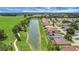 Aerial view of the homes located on a lake and golf course in a beautiful Florida community at 2880 Manor Downs, The Villages, FL 32162