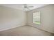 Cozy bedroom with natural light, carpet, and ceiling fan at 2880 Manor Downs, The Villages, FL 32162