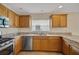 Updated kitchen with stainless steel appliances and granite countertops at 2880 Manor Downs, The Villages, FL 32162