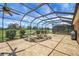 Screened lanai with beautiful water feature, ceiling fans, and view of the pond at 2880 Manor Downs, The Villages, FL 32162