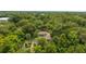 Aerial view of the property with lush greenery, pool, and screened-in lanai at 32511 County Road 437, Sorrento, FL 32776