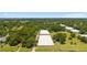 Expansive aerial view of the property with large structures and lush greenery at 32511 County Road 437, Sorrento, FL 32776