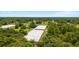 Aerial shot showcases the scale and size of the greenhouse and the buildings on the property at 32511 County Road 437, Sorrento, FL 32776
