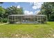 Spacious yard with a large screened pool, a perfect outdoor recreational area at 32511 County Road 437, Sorrento, FL 32776