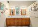 Charming bathroom boasts a double vanity, ample cabinet space, and warm wood accents at 32511 County Road 437, Sorrento, FL 32776