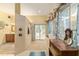 Bright bathroom with an oversized shower, natural light, and a separate vanity area at 32511 County Road 437, Sorrento, FL 32776