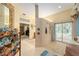 Bathroom featuring a large tiled shower, vanity with a sink, and neutral color palette at 32511 County Road 437, Sorrento, FL 32776