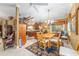 Open-concept dining room with wood table, chandelier, and tile flooring at 32511 County Road 437, Sorrento, FL 32776