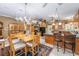 Large dining room featuring hardwood table, chandelier, and tile flooring at 32511 County Road 437, Sorrento, FL 32776