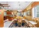 Traditional dining room featuring a wood table, chandelier, and large windows at 32511 County Road 437, Sorrento, FL 32776