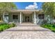 Charming home featuring a stone pathway leading to a covered front porch with classic columns at 32511 County Road 437, Sorrento, FL 32776