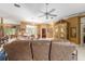 Inviting living room featuring comfortable couches, tile floors, and a view into another room at 32511 County Road 437, Sorrento, FL 32776