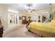 Bright main bedroom featuring a large window and access to closets at 32511 County Road 437, Sorrento, FL 32776