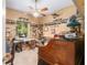 Unique office space with built in shelves, a ceiling fan, and a large antique desk at 32511 County Road 437, Sorrento, FL 32776