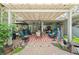 Charming covered patio with comfortable seating, creating a perfect space for outdoor gatherings at 32511 County Road 437, Sorrento, FL 32776