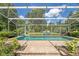 Sparkling pool is enclosed in a screened enclosure with plenty of space for relaxing at 32511 County Road 437, Sorrento, FL 32776