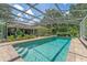 Sparkling in-ground screened pool with brick trim, inviting relaxation and outdoor enjoyment at 32511 County Road 437, Sorrento, FL 32776