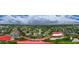 Expansive aerial view of a neighborhood with mature trees and nearby amenities at 3309 Paisley Cir, Orlando, FL 32817