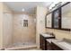 This bathroom features a tile surround shower with a niche and a double vanity with granite countertops at 3309 Paisley Cir, Orlando, FL 32817