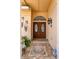 Inviting double front doors with decorative glass details, set against a tiled entryway with decorative ornaments at 3309 Paisley Cir, Orlando, FL 32817
