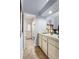 Bright kitchen area featuring ample counter space, tiled floors, and an adjacent door to the exterior at 3309 Paisley Cir, Orlando, FL 32817