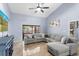 This living room boasts tile floors, high ceilings, neutral decor, and a large sectional sofa at 3309 Paisley Cir, Orlando, FL 32817