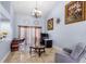 Comfortable living room with a large picture window, a cozy armchair, and a stylish glass coffee table at 3309 Paisley Cir, Orlando, FL 32817