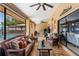 Relaxing covered patio with comfortable seating, ceiling fans, and views of the pool area at 3309 Paisley Cir, Orlando, FL 32817