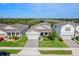 Aerial view of a well-maintained home, with landscaped front yard, paved driveway, and neighborhood views at 3467 Buoy Cir, Winter Garden, FL 34787