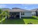 Spacious backyard featuring a screened-in lanai and neatly kept lawn at 3467 Buoy Cir, Winter Garden, FL 34787