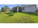 Large grassy backyard with a screened-in lanai, perfect for outdoor enjoyment at 3467 Buoy Cir, Winter Garden, FL 34787
