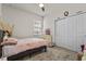 Cozy bedroom with carpet, closet, TV, and a window with natural light at 3467 Buoy Cir, Winter Garden, FL 34787