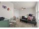 Bright bedroom with a ceiling fan and carpet, featuring a futon and desk at 3467 Buoy Cir, Winter Garden, FL 34787