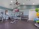 Well-equipped fitness center with weights, cardio machines, and a mirrored wall at 3467 Buoy Cir, Winter Garden, FL 34787