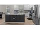 Modern kitchen featuring white cabinets, stainless steel appliances, kitchen island, and tile floors at 3467 Buoy Cir, Winter Garden, FL 34787