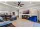 Comfortable living room with a ceiling fan, and stylish furniture, seamlessly connected to the dining area at 3467 Buoy Cir, Winter Garden, FL 34787