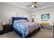 Comfortable primary bedroom with a tray ceiling, fan, a king bed and an ensuite bathroom at 3467 Buoy Cir, Winter Garden, FL 34787