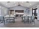 Bright meeting room with tables, chairs, and a refreshment area for gatherings at 3467 Buoy Cir, Winter Garden, FL 34787