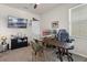 Spacious home office with dual monitors, modern chair, and a TV at 3467 Buoy Cir, Winter Garden, FL 34787