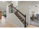 Staircase with decorative metal railing and carpeted steps, leading to an upper level at 3467 Buoy Cir, Winter Garden, FL 34787