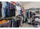 Spacious walk-in closet with ample shelving and hanging space for organized storage at 3467 Buoy Cir, Winter Garden, FL 34787