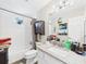 Cozy bathroom with tiled shower/tub and large vanity with granite counters and storage space at 4207 Bair Ave, Fruitland Park, FL 34731