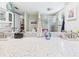Bathroom with double vanity sink and sliding glass door shower at 4207 Bair Ave, Fruitland Park, FL 34731