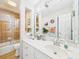 Bathroom featuring a shower with glass doors, large mirror and vanity at 4207 Bair Ave, Fruitland Park, FL 34731