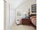 Bedroom features an ornate four poster bed, side table, window and large closet at 4207 Bair Ave, Fruitland Park, FL 34731