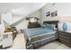 Bedroom with vaulted ceiling and dormer window, showcasing comfortable furnishings and decor at 4207 Bair Ave, Fruitland Park, FL 34731