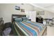 Bedroom with vaulted ceiling, dormer window and comfortable furnishings and decor at 4207 Bair Ave, Fruitland Park, FL 34731