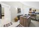 Spacious walk-in closet showcasing ample shoe storage and a central island dresser at 4207 Bair Ave, Fruitland Park, FL 34731