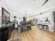 Dining area with stylish light fixture, bench seating and wood-look flooring at 4207 Bair Ave, Fruitland Park, FL 34731