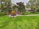 Traditional home with lush landscaping, arched entryway, and brick accents, creating a welcoming facade at 4207 Bair Ave, Fruitland Park, FL 34731